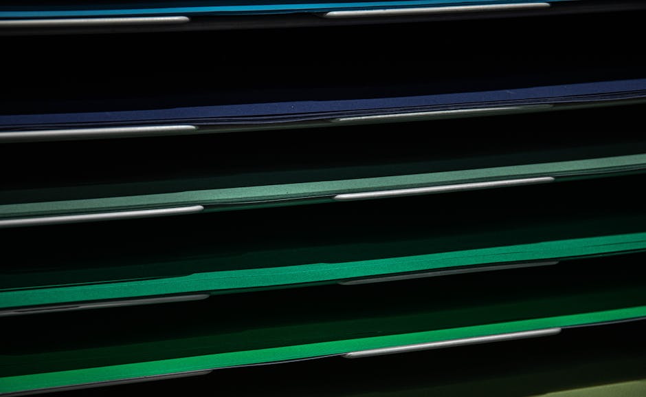 Close-up view of assorted colored paper in a stacking rack, perfect for school or office use.
