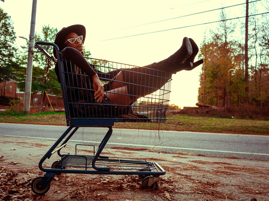 Fashionable woman lounging in a shopping cart on a sunny day in Atlanta, Georgia.